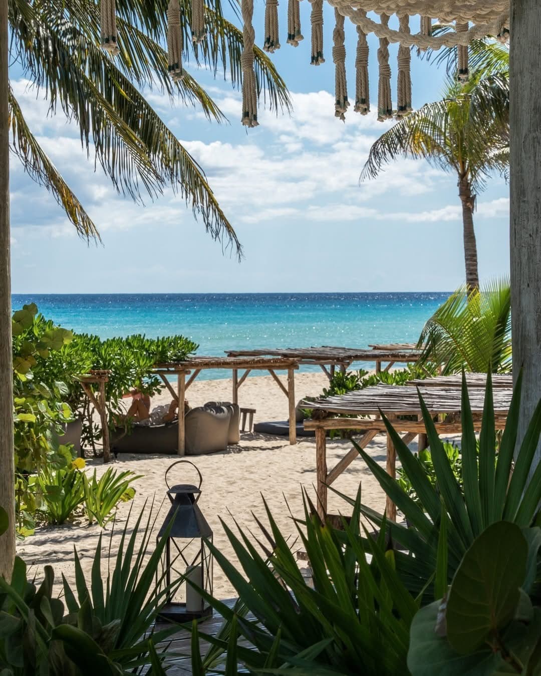 The beach at Palmaïa, seen through the palms